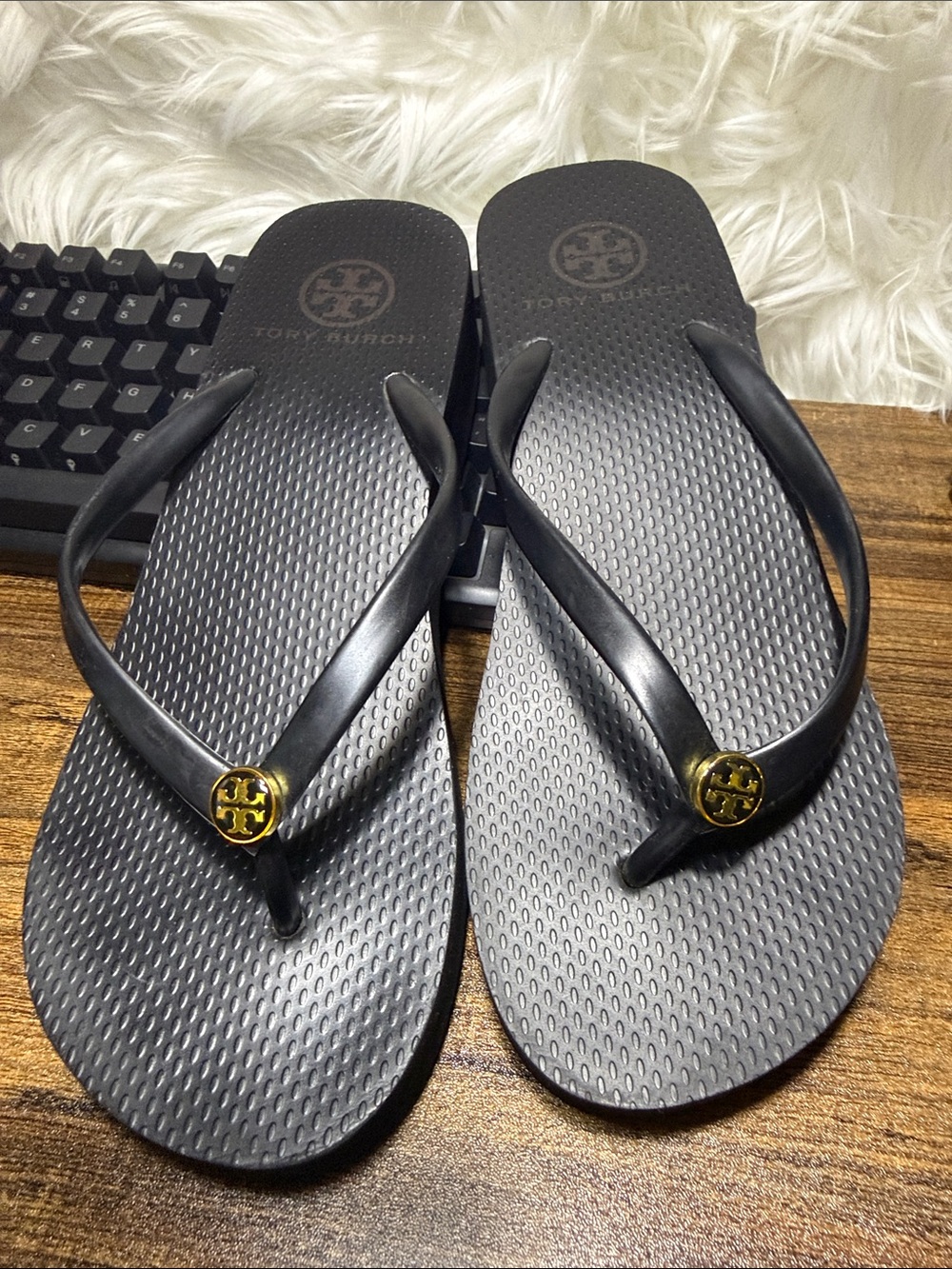 Tory Burch Black Flip Flops with Gold Logo Medallion